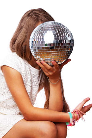 Portrait of little girl playing with discoball in studioの写真素材