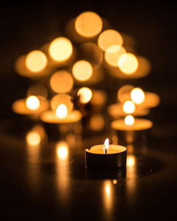 Bokeh image of candles in a dark studio