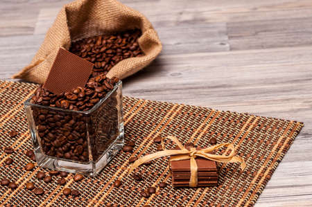 Chocolate, a jar and a sack of coffee beans