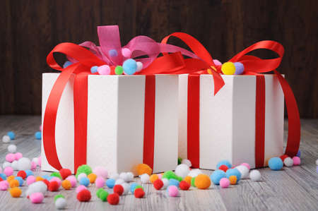 Colorful felt beads around two boxes