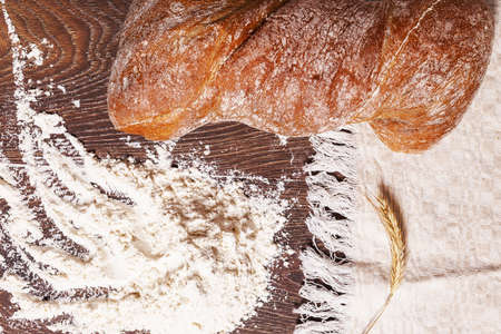 Eco bread and flour on woodの写真素材