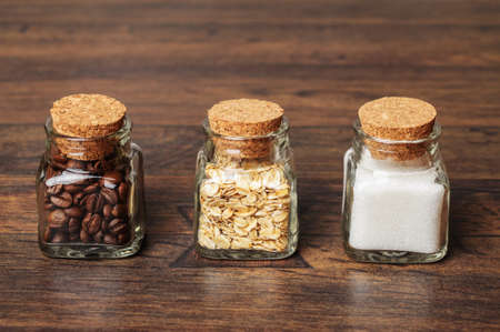 Jars of coffee, oats, and sugarの写真素材