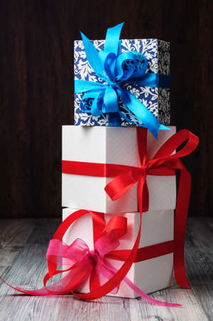White and blue gift boxes on the floor