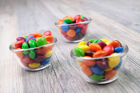 Bowls with candies of different color