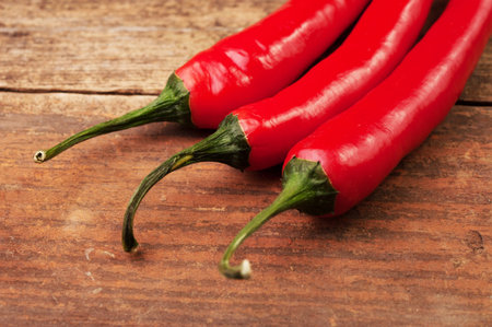 Three chilli peppers on the table