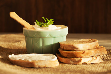 Sliced bread and cream cheese in the morning
