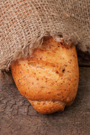 A linen cloth covering a loaf of bread