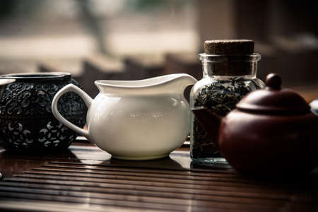 A saucer and a teapot reade for a tea ceremonyの写真素材