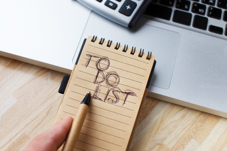 A to-do list and a laptop