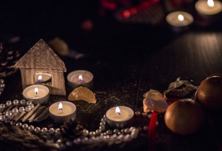 Candles, jewelry and mandarines
