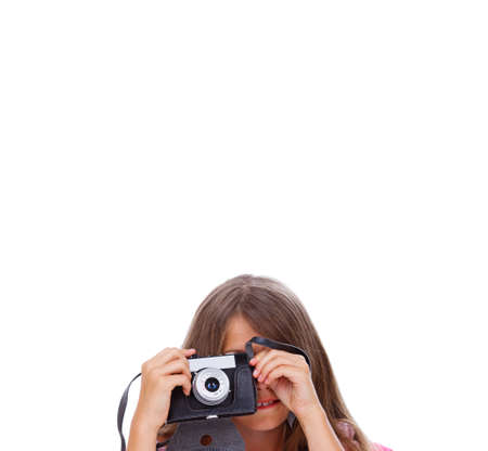 Portrait of beautiful girl posing in studio with cameraの写真素材