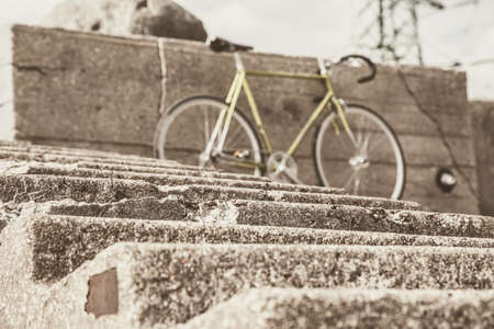 Image of bicycle and ladder in front of itの写真素材