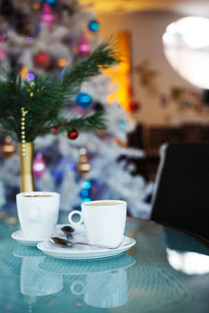 Photo of  white cup with tasty coffee, Christmastime table setting.Christmas mood.の写真素材