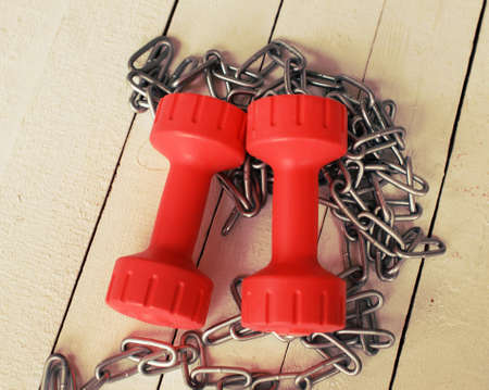 Image of a pair of dumbbells and a chainの写真素材