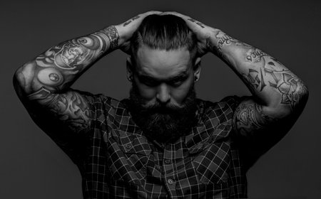 Picture of brutal tattooed male with beard
