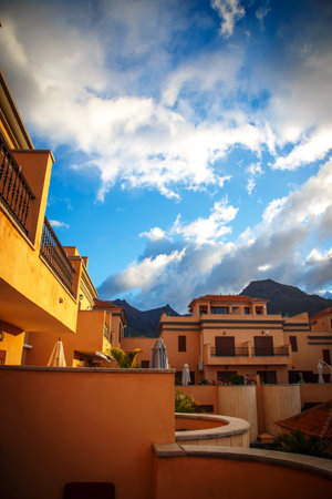 Picture of tropical town and blue sky with fluffy clouds