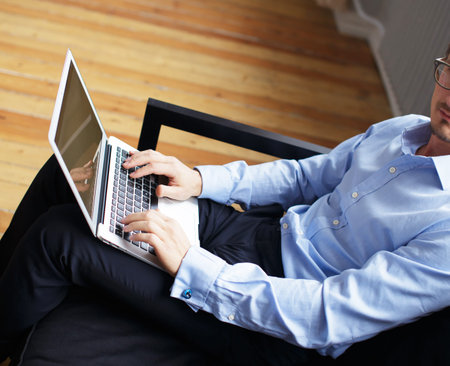 Young business man working with laptop in office.の写真素材
