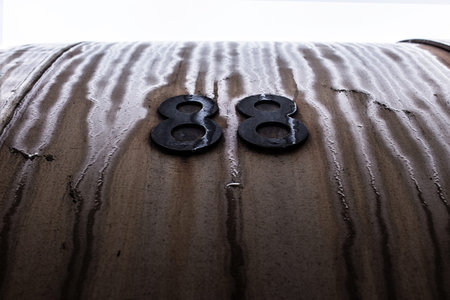 Black digits on brown and rusty background.の写真素材