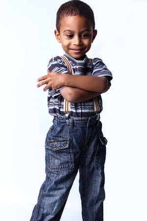 Happy black african child in studio isolated on white.の写真素材