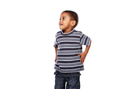 Happy black african child in studio isolated on white.の写真素材