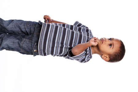 Happy black african child in studio isolated on white.の写真素材