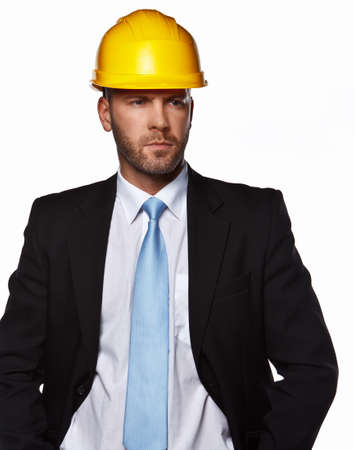 Male in a suit with hard hat isolated on whiteの写真素材