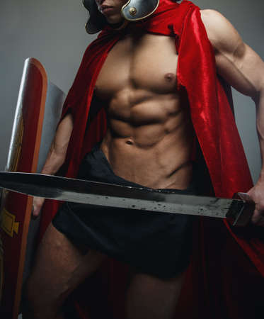 Roman warrior with sword and shield isolated on grey.の写真素材