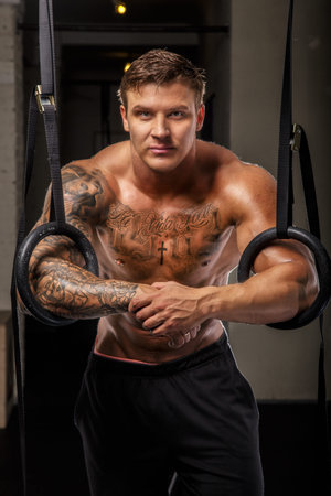 Bodybuilder posing in a gym
