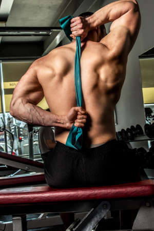 Bodyboulder doing worm up in a gym before exercises