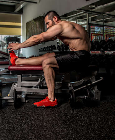 Bodyboulder doing worm up in a gym before exercisesの写真素材