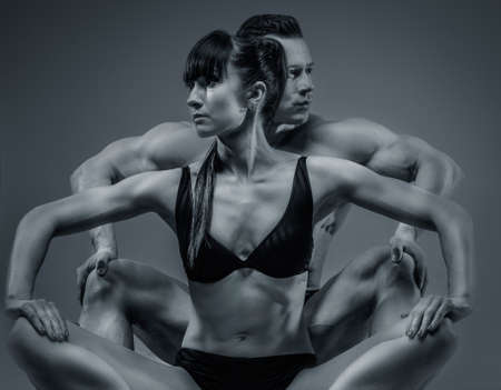 Bodybuilders couple in underwear. Isolated on greyの写真素材