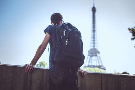 Tourist with bag on eiffel tower background.の写真素材