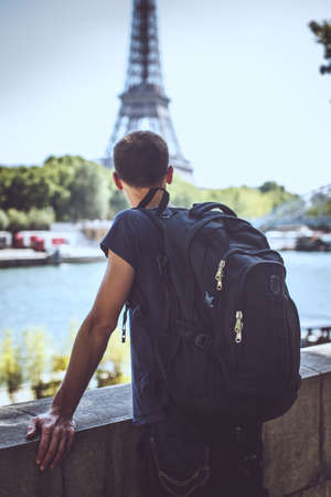 Tourist on the bridge near eiffel tower.の写真素材