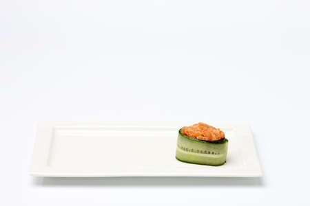 Fancy desert on white plate isolated on white background.の写真素材