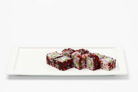 Different pieces of sushi on white square plate isolated on white background.の写真素材