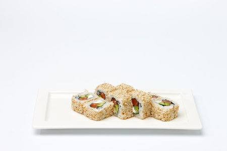 Pieces of sushi on white ceramic plate. Isolated on white background.の写真素材