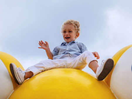 Scared little blond boy.の写真素材