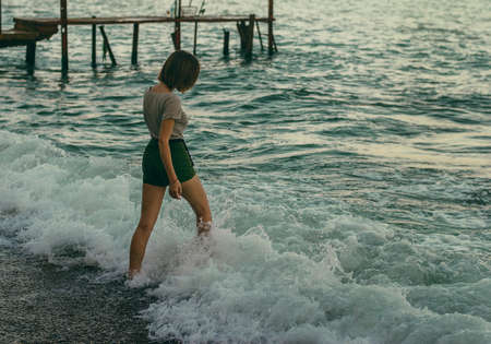 Middle age woman in sea wave.の写真素材