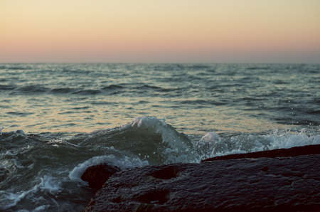 Sea waves on the sunset.の写真素材