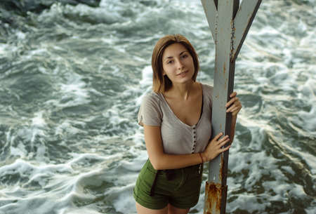 Middle age woman in sea wave.