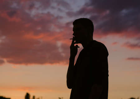 Smoking man silhouette.の写真素材