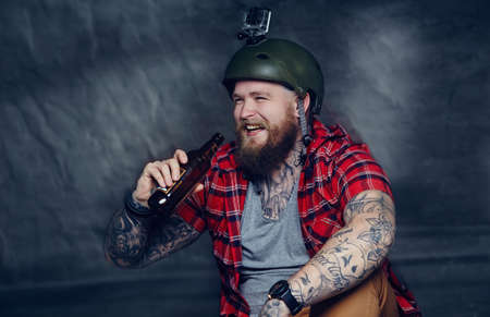 Smiling bearded man drinking beer.の写真素材