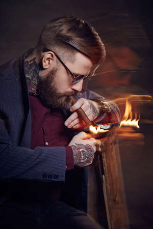 Bearded man smocking cigar.の写真素材