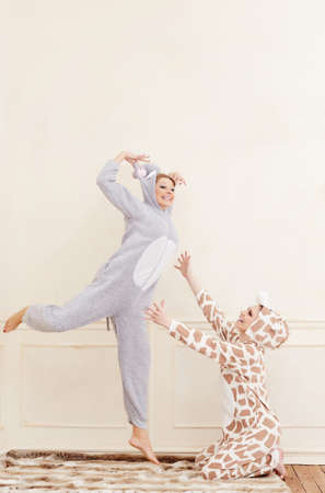 Two playful women in pajamas.の写真素材