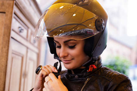 Portrait of cute young woman in a moto helmet.
