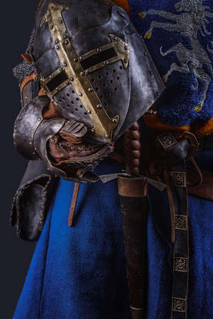 Knight's helmet in a hand.の写真素材