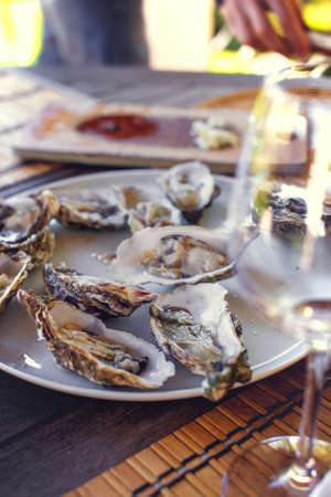 Seafood and glass of wine.の写真素材