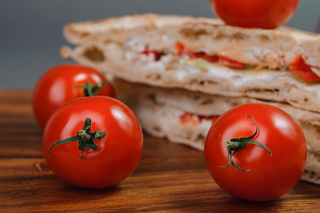 Tasty sandwich and fresh tomatoes.