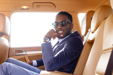 Blackman in a suit in the car.の写真素材