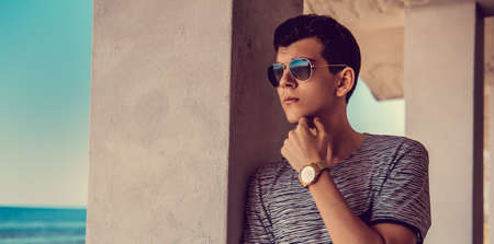 Portrait of young guy in sunglasses.の写真素材